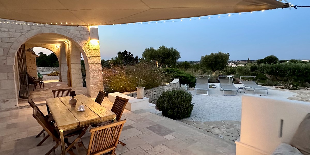 Trulli Pietra Luna Bosco Selva Outside Table Night